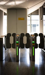 A row of turns at an airport with green lights