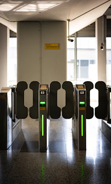 A row of turns at an airport with green lights