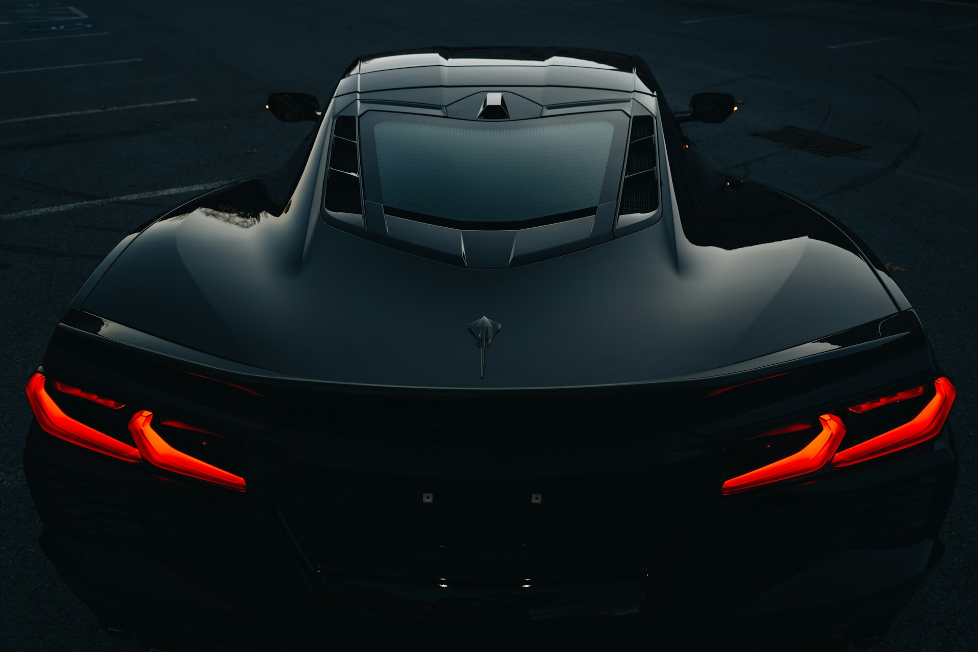 A black sports car parked in a parking lot