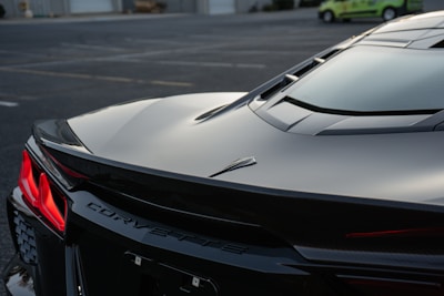 A black sports car parked in a parking lot