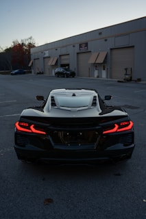 A black sports car parked in a parking lot