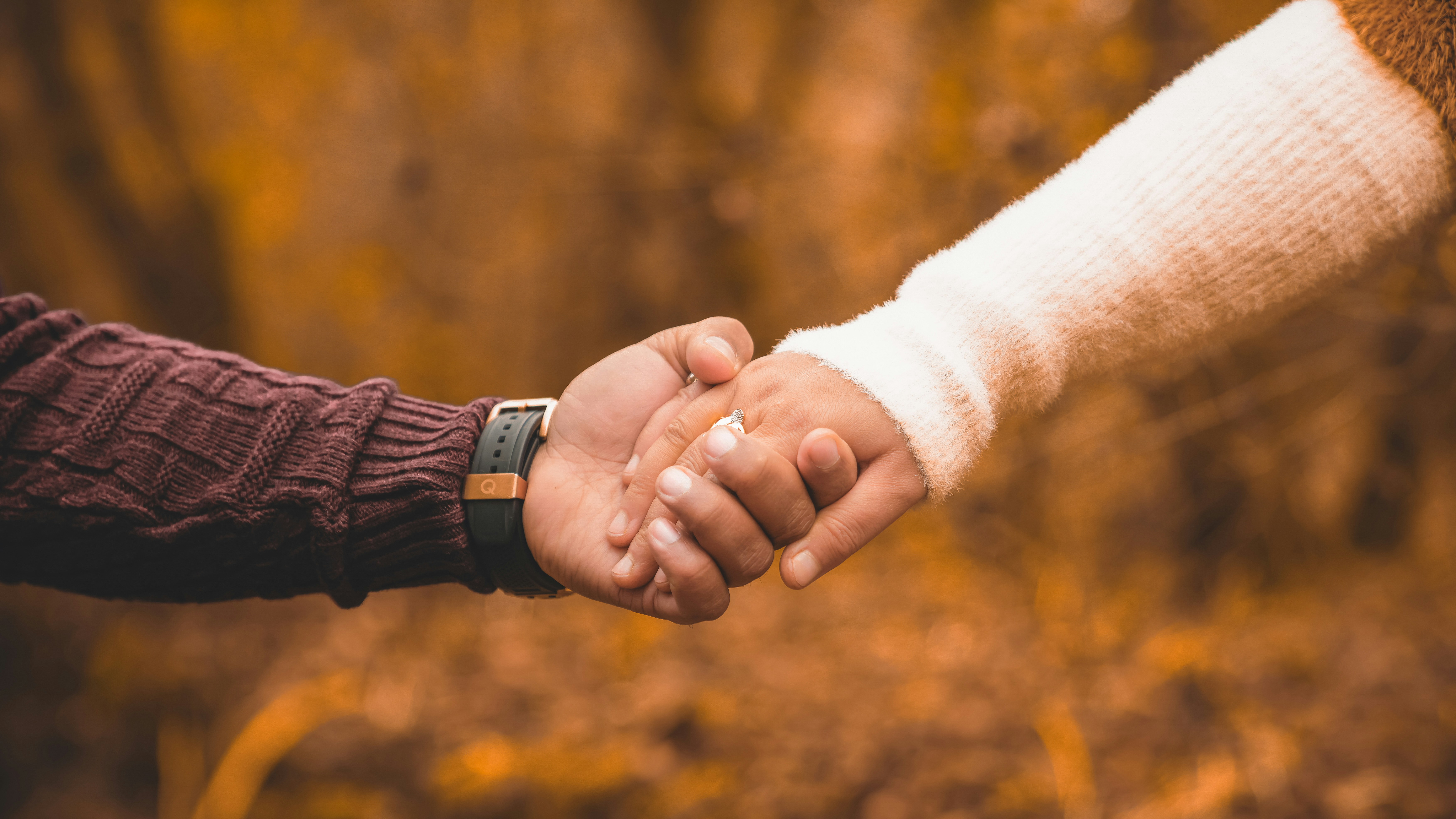 woman wearing yellow long-sleeved dress under white clouds and blue sky during daytime