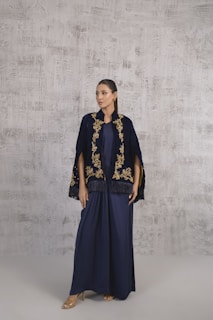 A woman standing in front of a wall