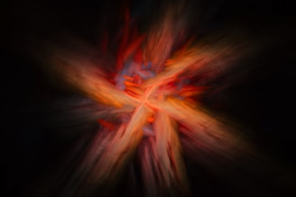 A blurry image of a cross on a black background