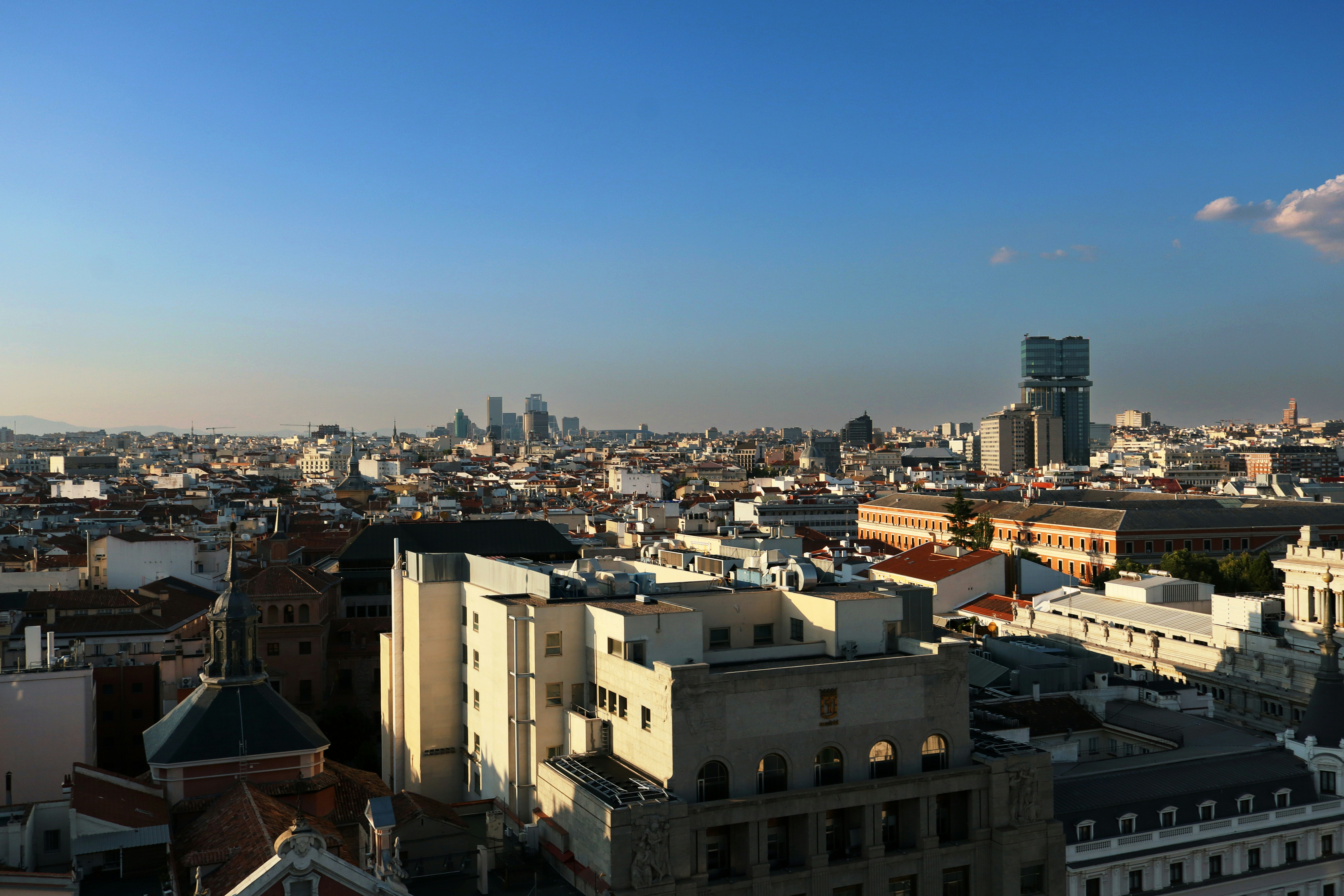 A panoramic view of a city with tall buildings