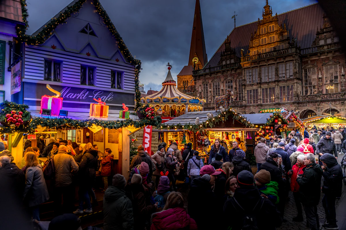 Crowd at a Christmas market in the evening