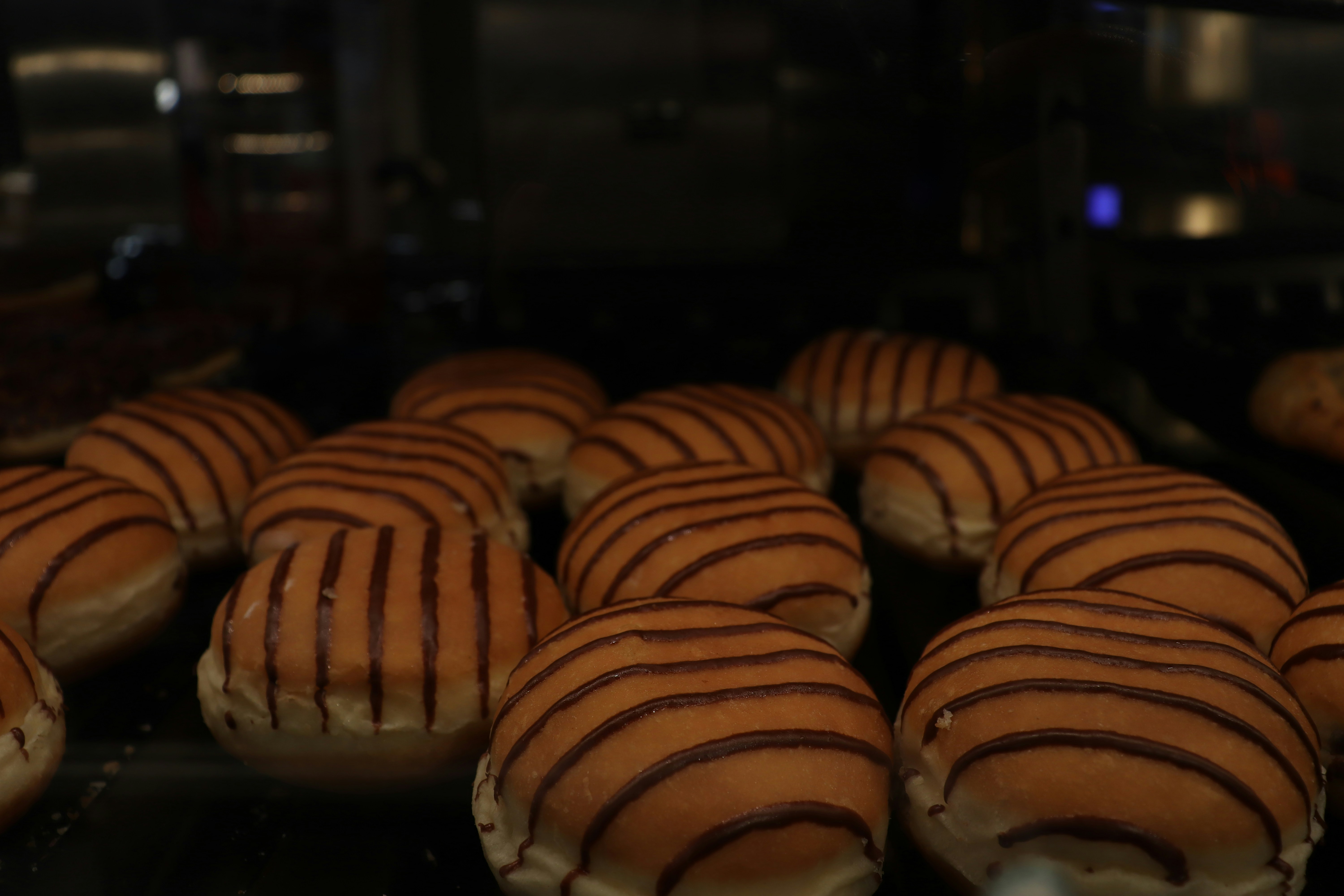 A close up of a bunch of doughnuts in a oven