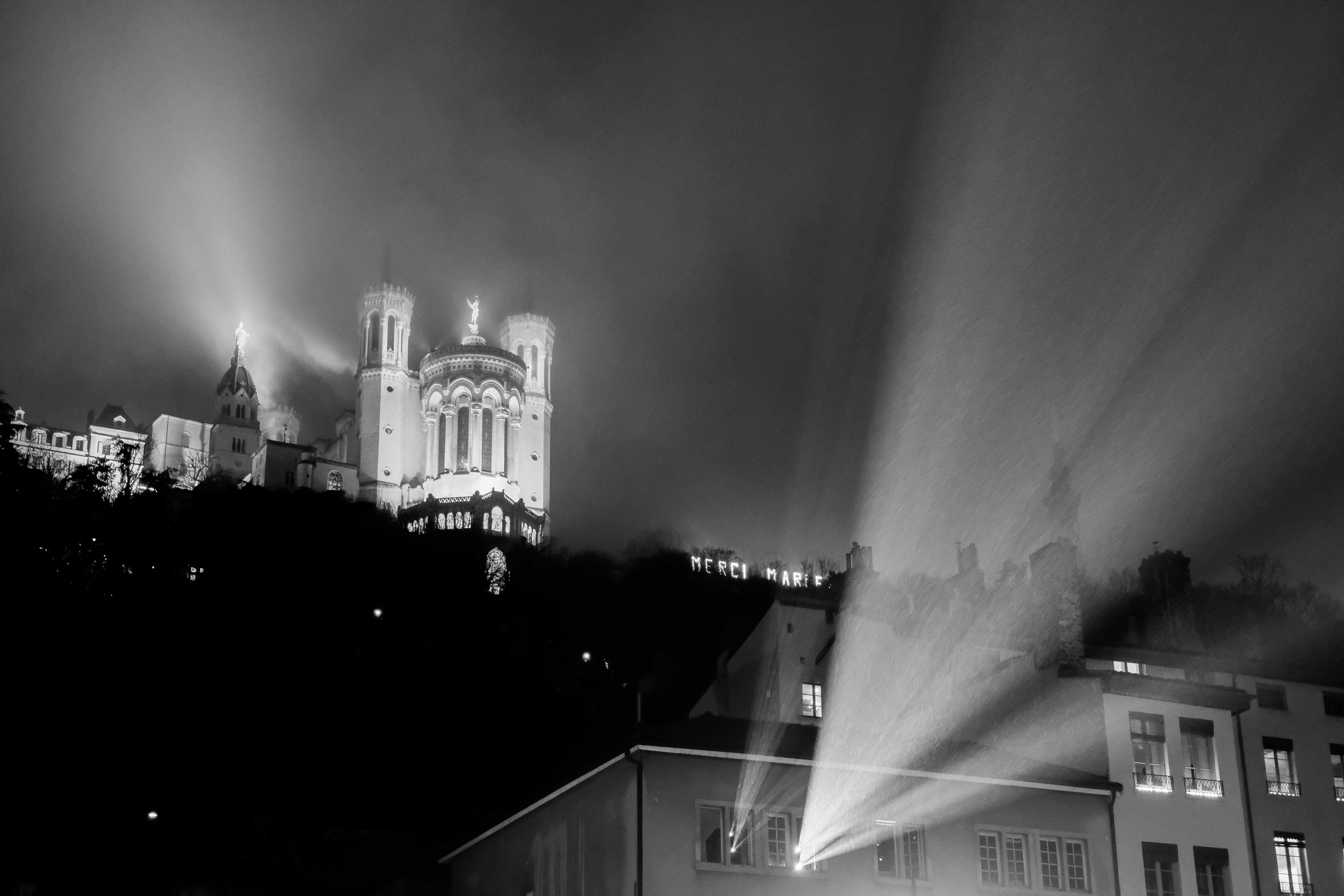 A black and white photo of a city at night