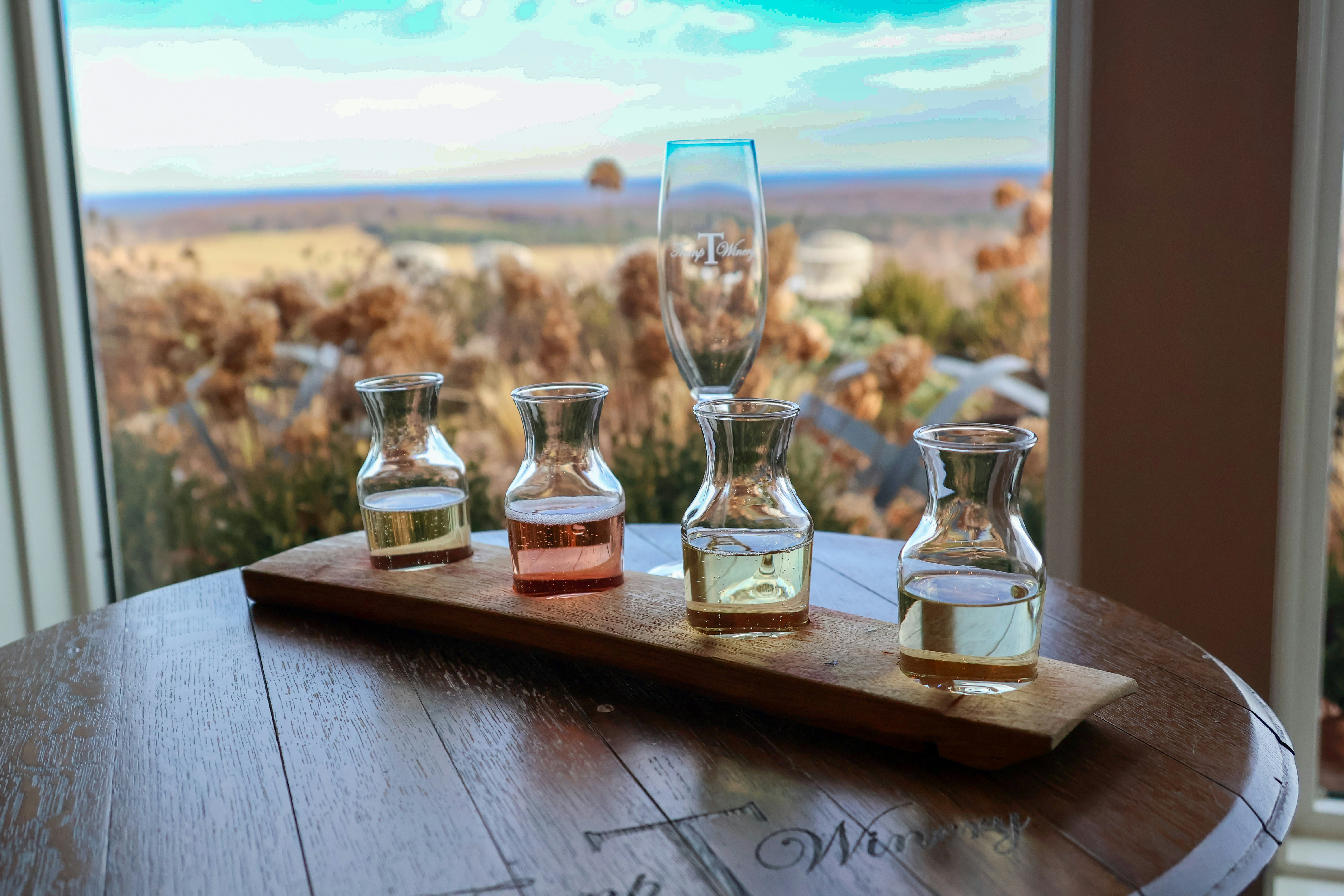 Beer tasting paddle on a round table by a window