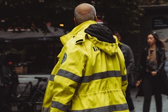 A man in a yellow fire fighter jacket