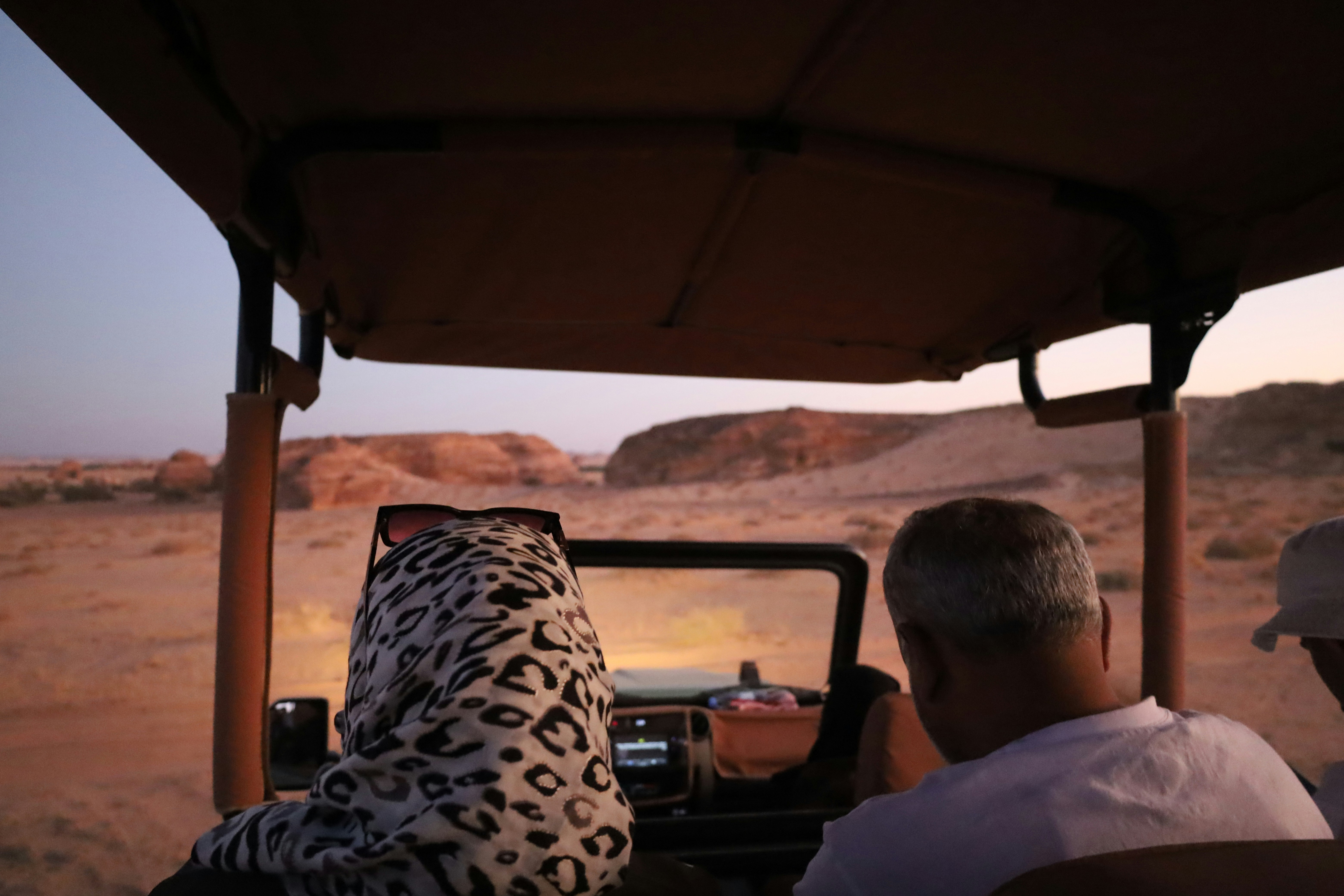 A couple of people that are in a vehicle