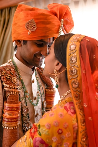 A man and woman dressed in traditional indian garb