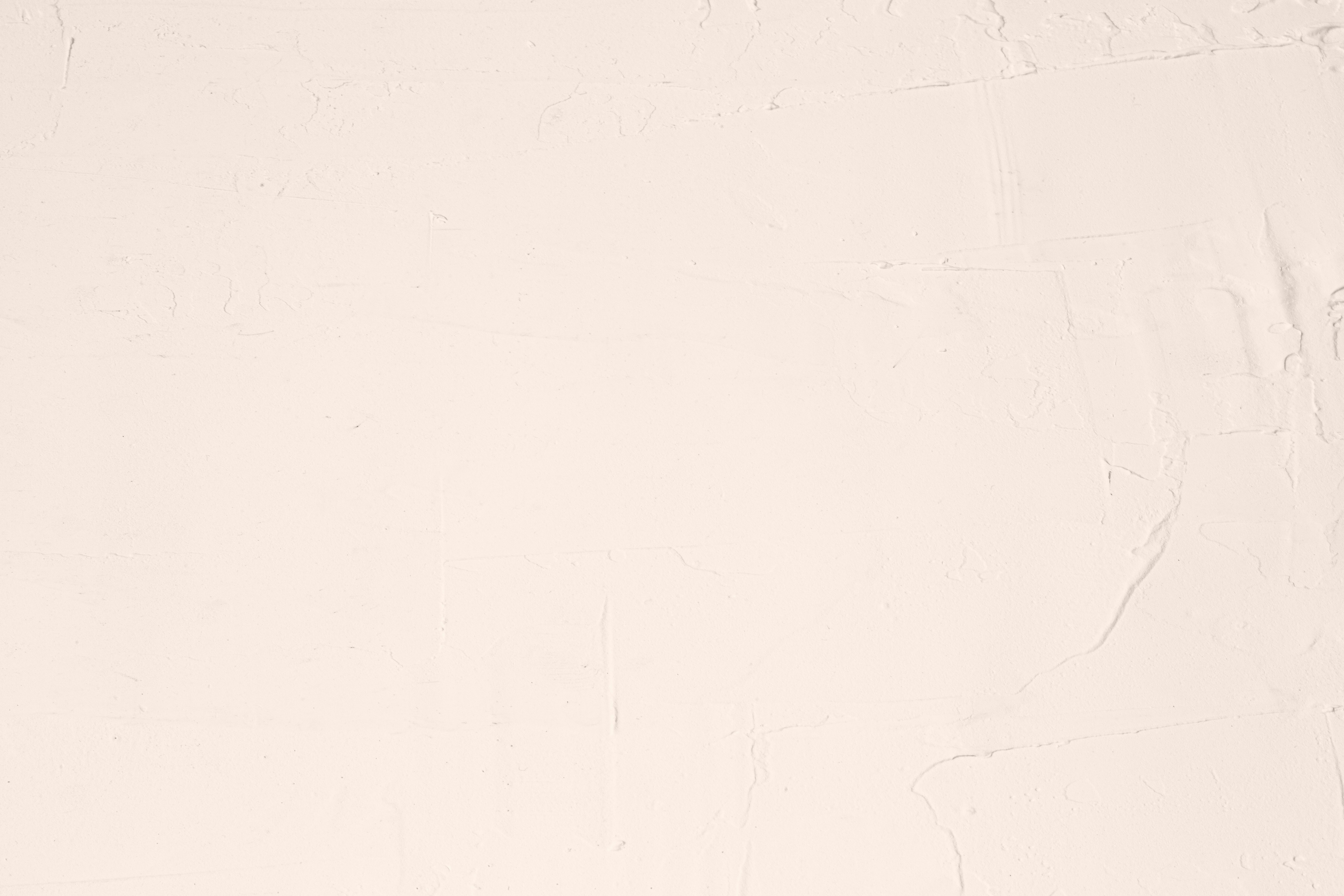 A white sheet with a black cat sitting on top of it