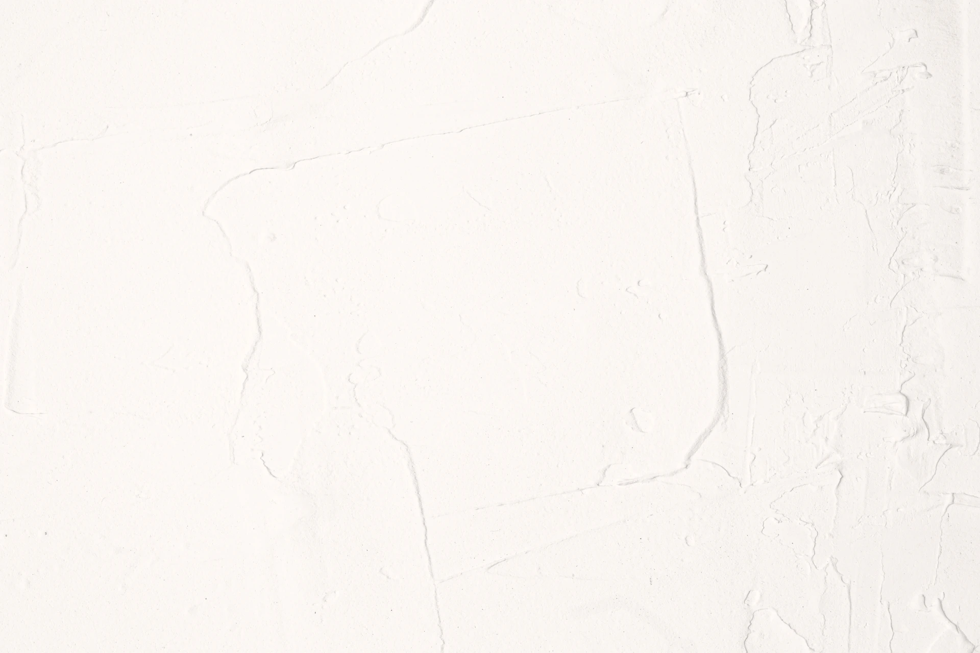 A white wall with a black and white clock on it