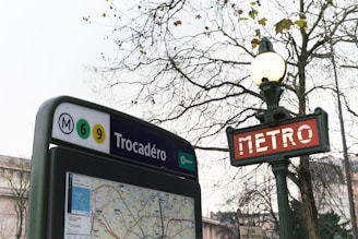 A bus stop sign with a map on it