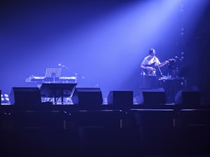 A concert scene with a band on stage