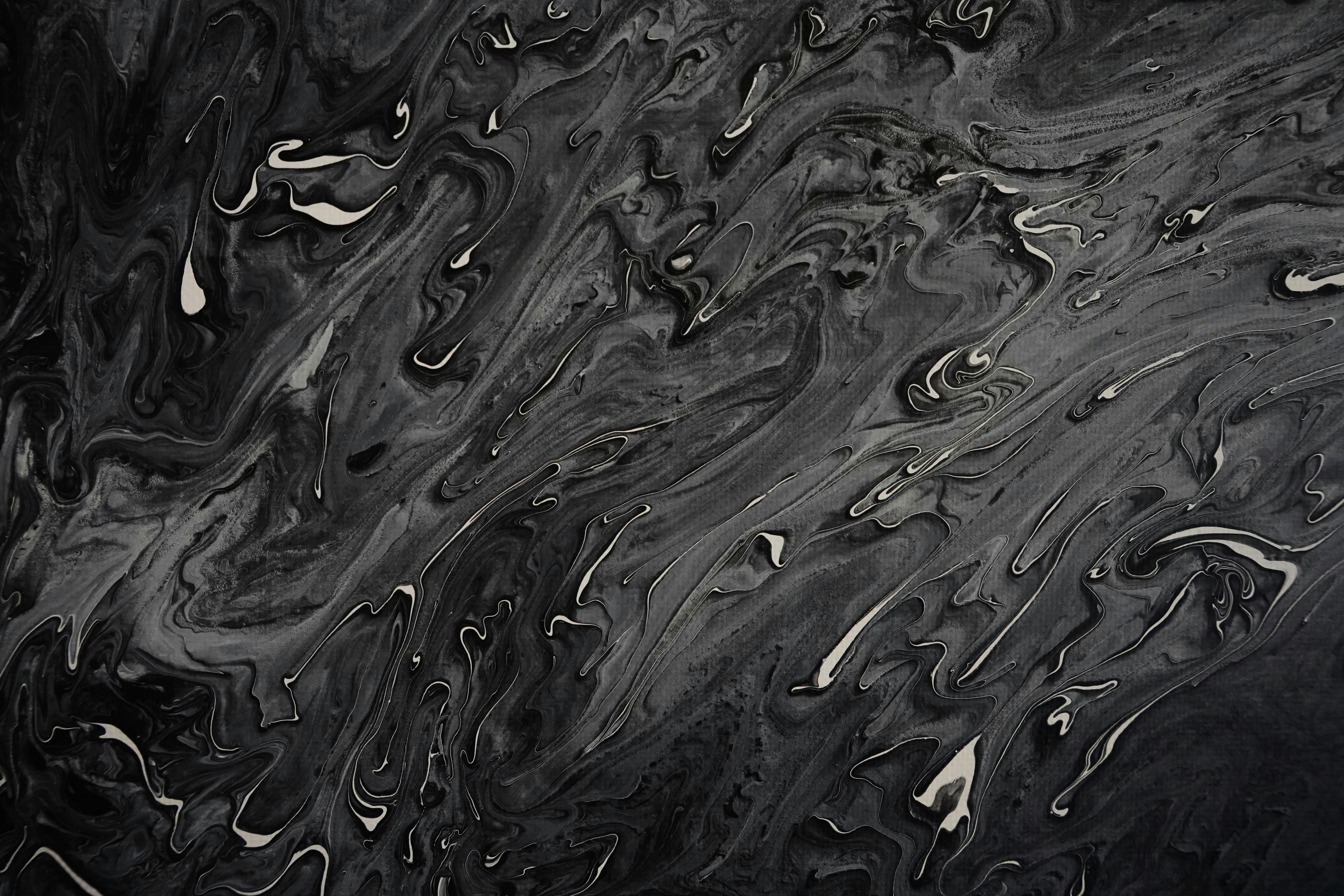 A black and white photo of water droplets