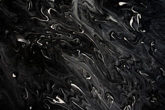 A black and white photo of water droplets