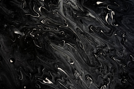 A black and white photo of water droplets
