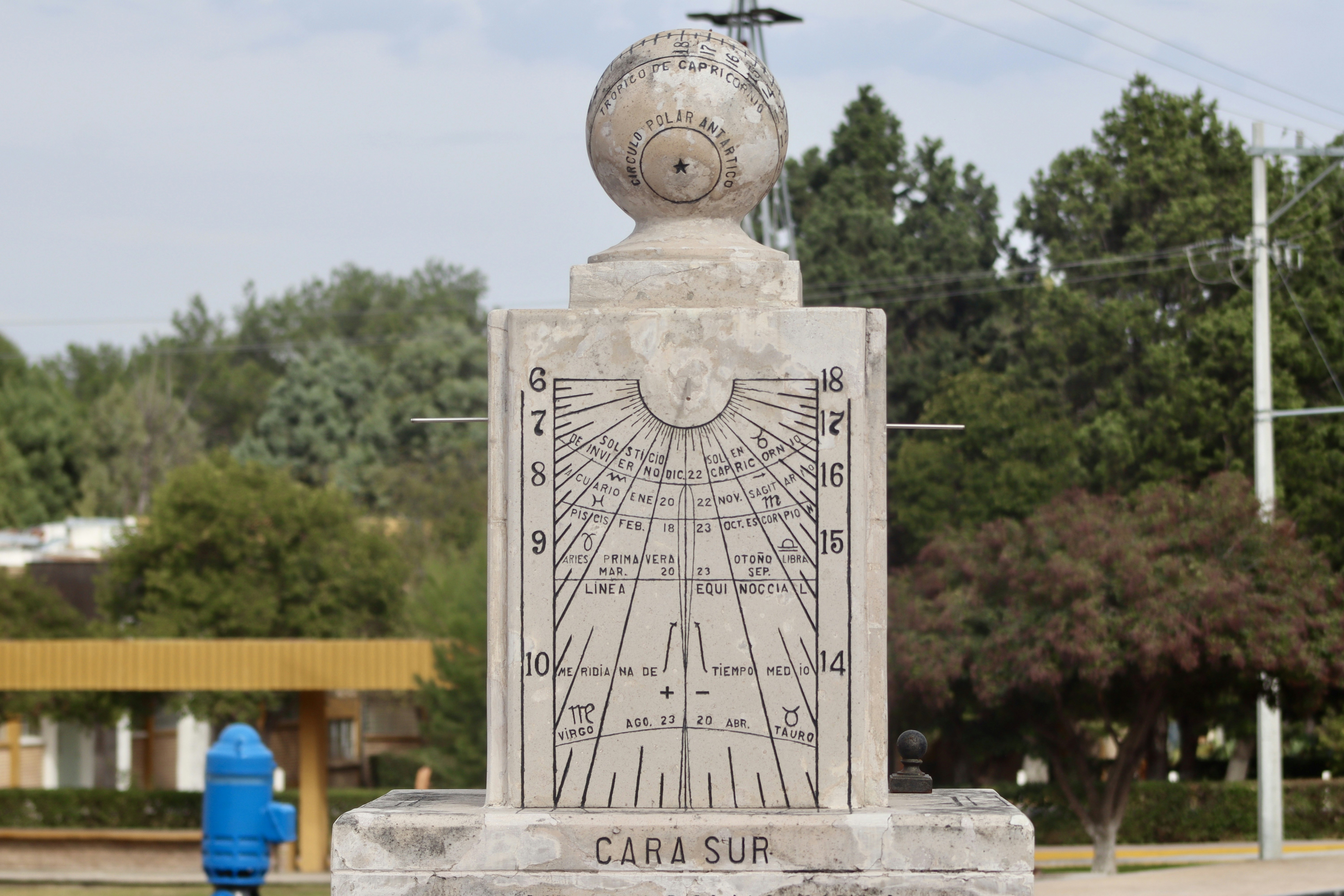 A monument with a bird sitting on top of it
