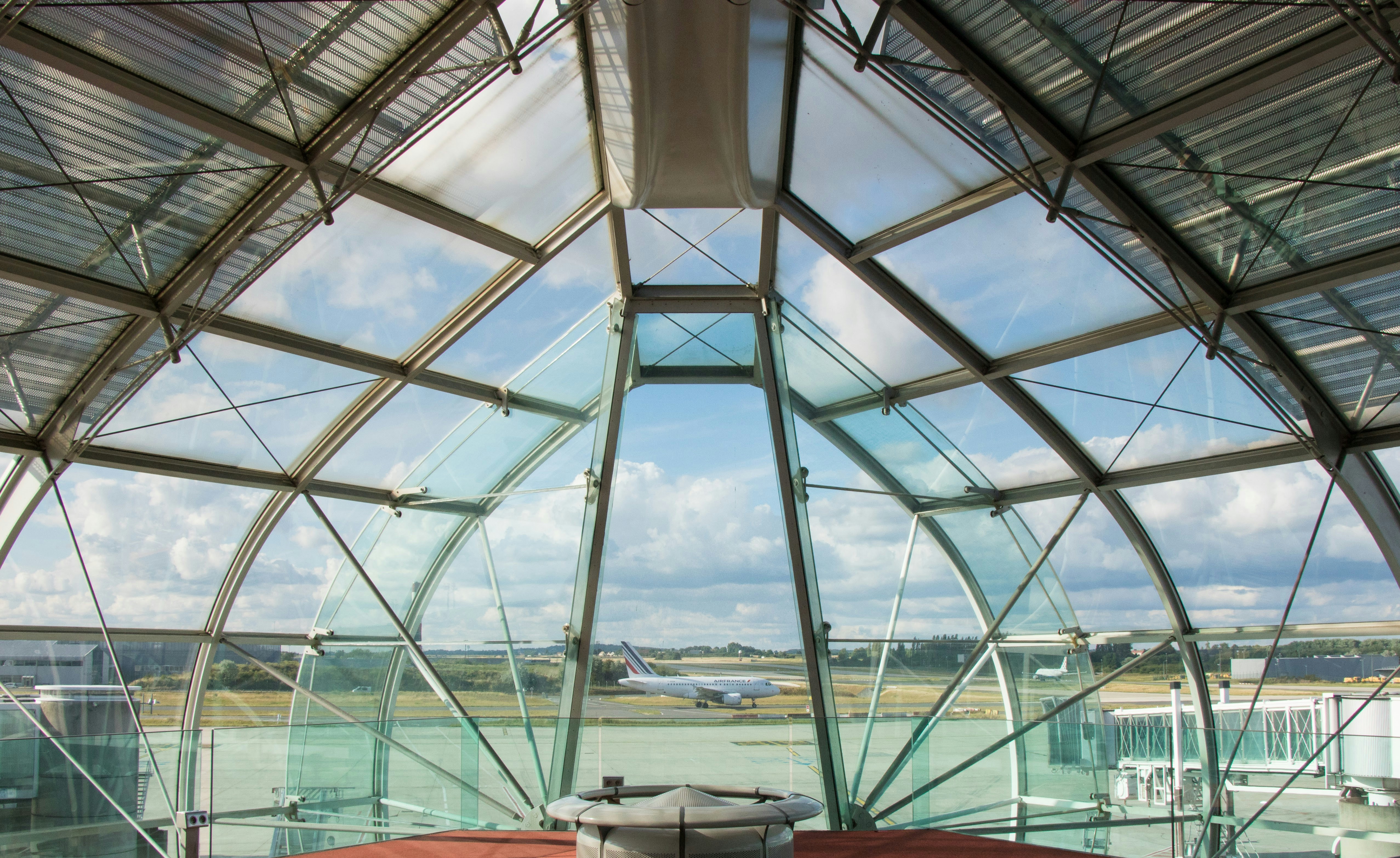 A view of the inside of a glass building photo – Free Airport Image on ...