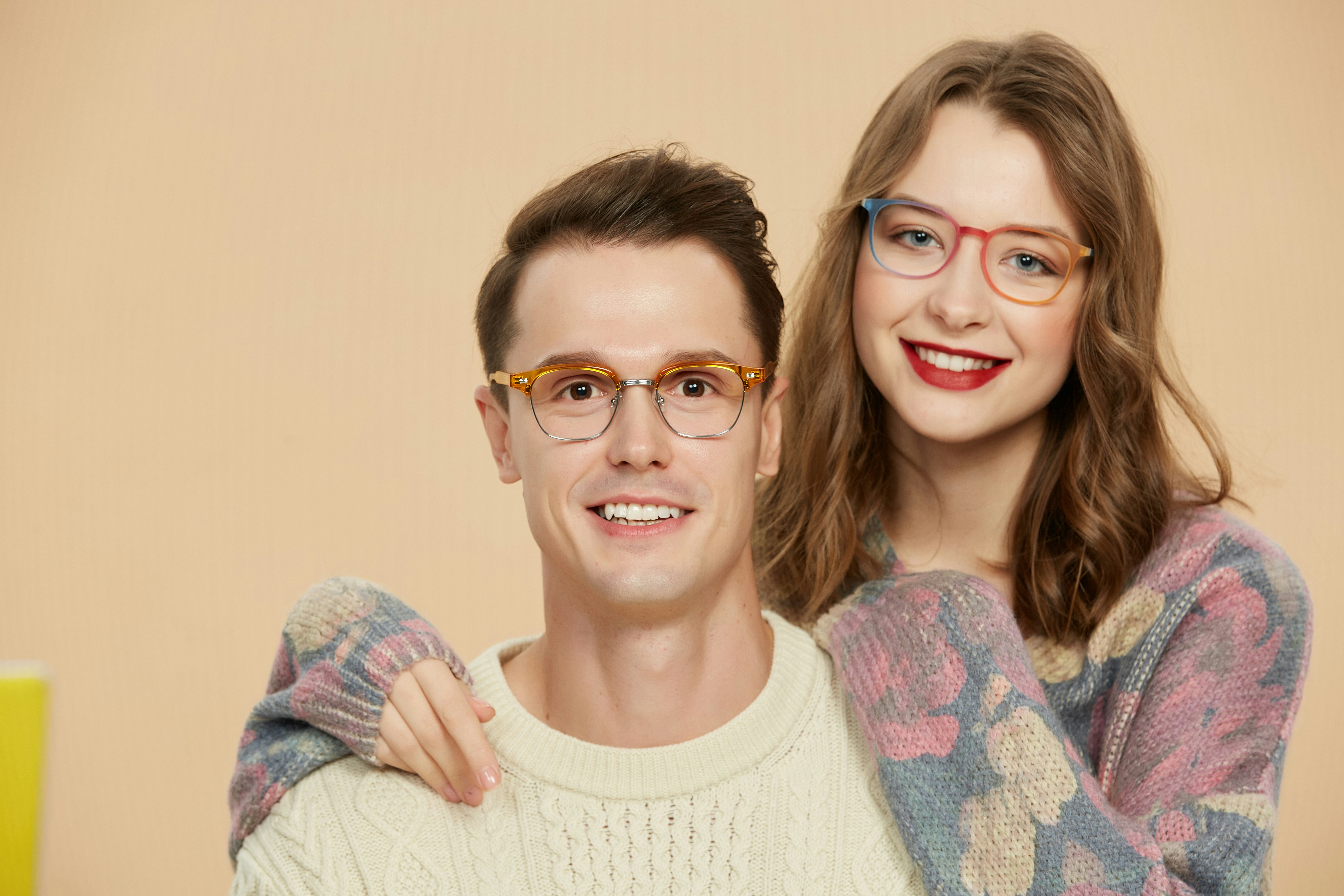 Stylish couple with colorful eyewear