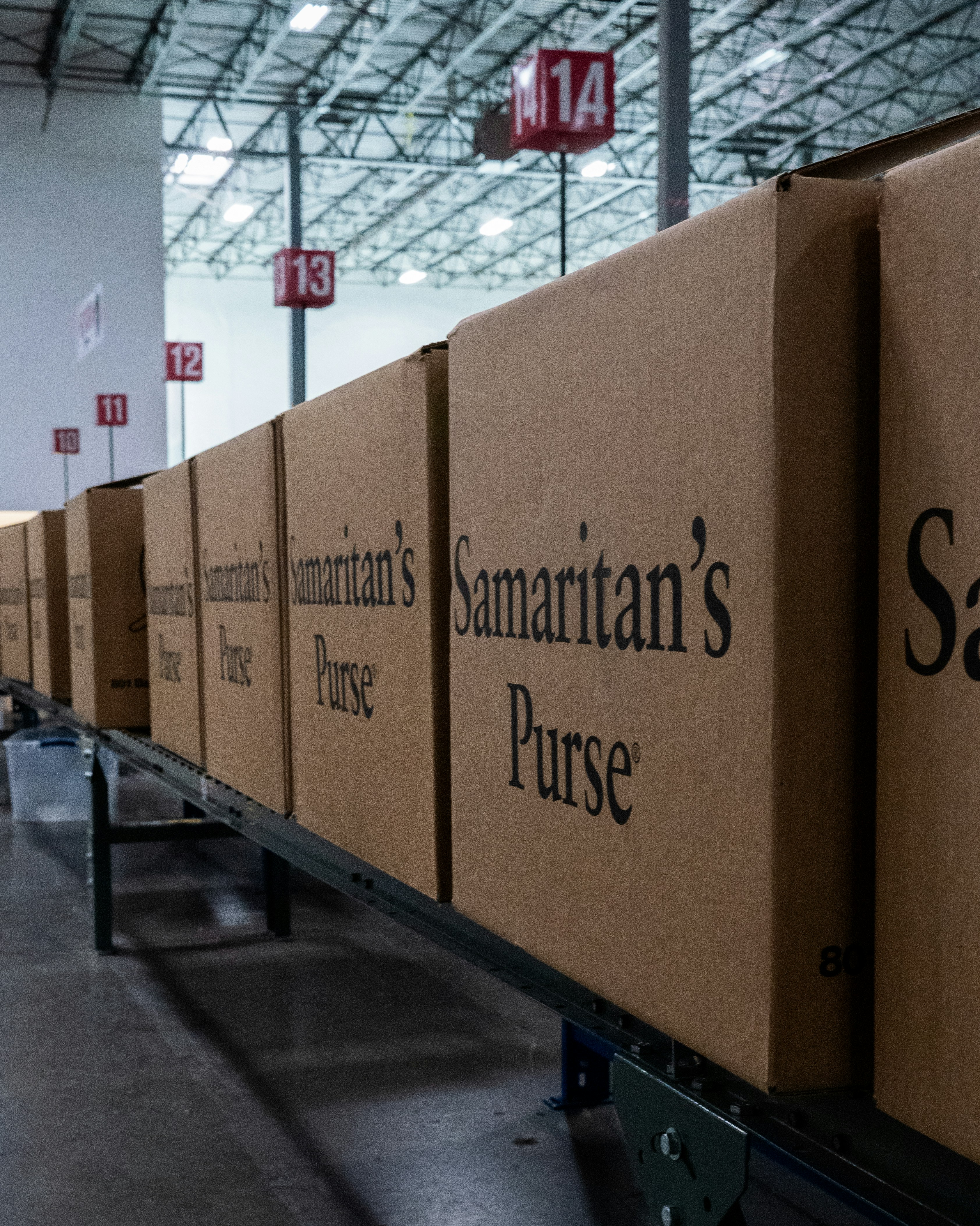 A row of boxes sitting on top of a conveyor belt