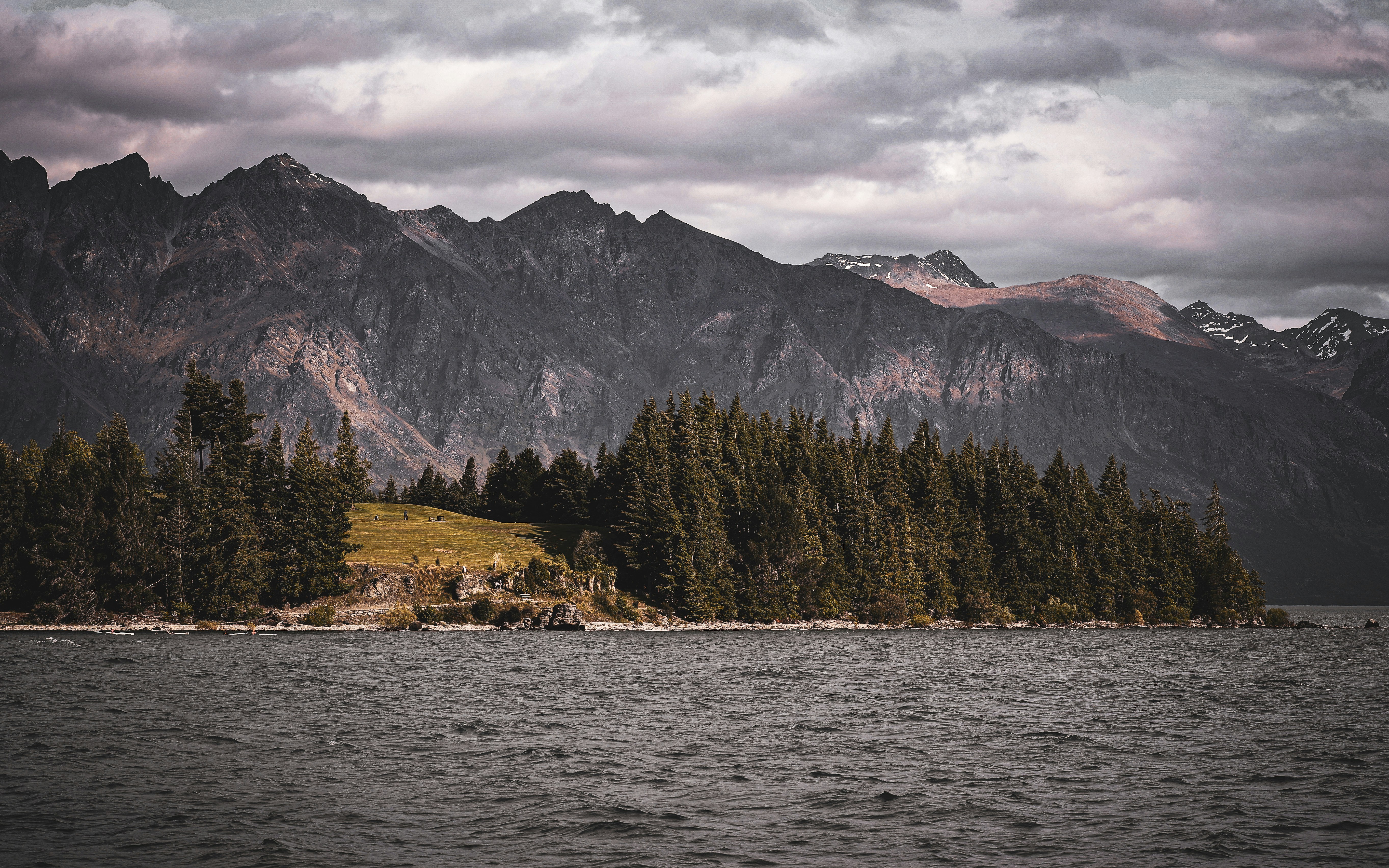 A large body of water surrounded by mountains