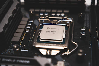 A cpu chip sitting on top of a computer