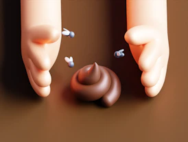 Two hands reaching for a snail on a table