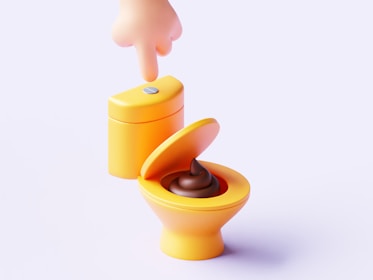 A toy toilet with the lid open and a person sticking their finger in the toilet