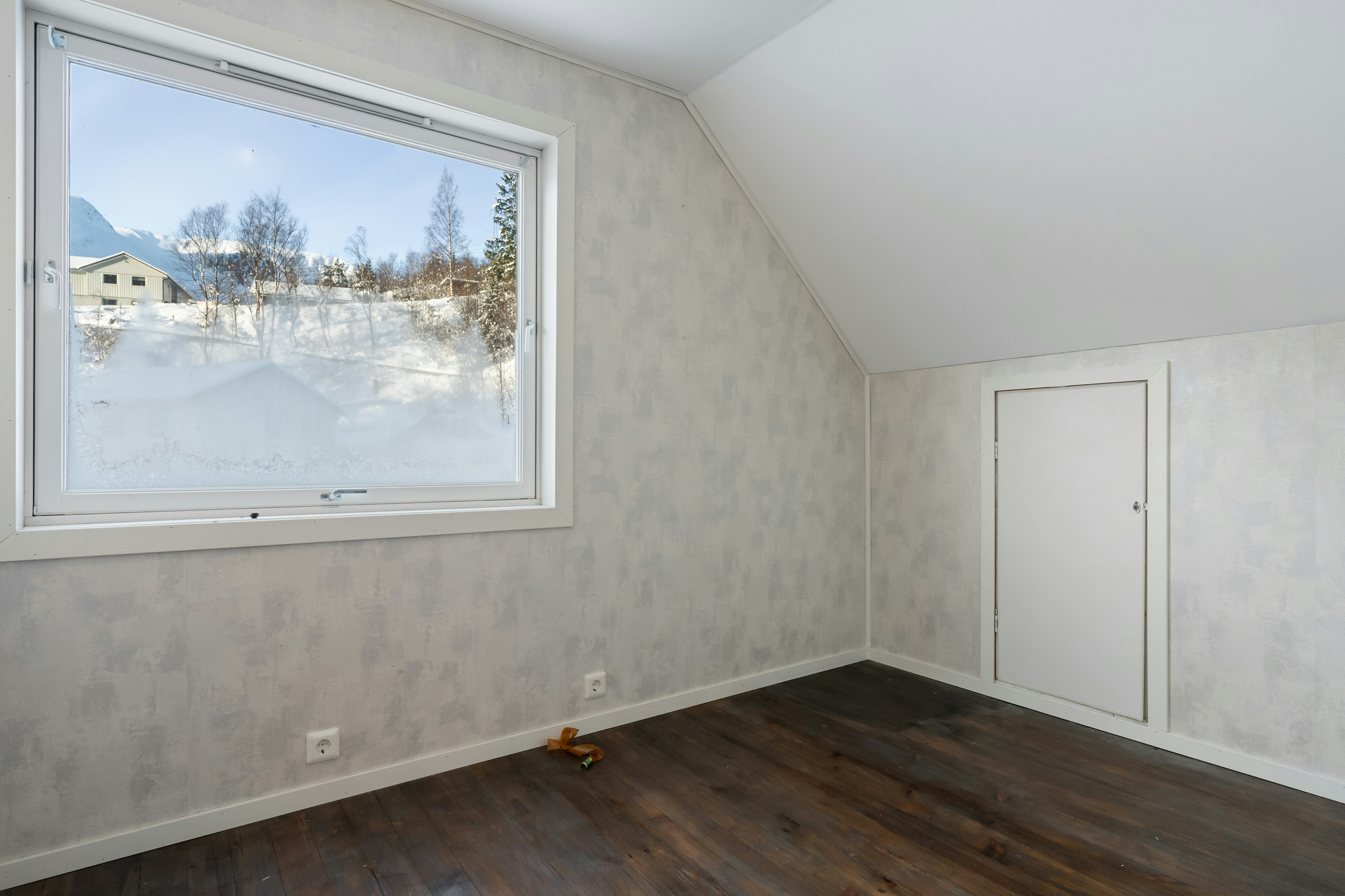 An empty room with a large window in it