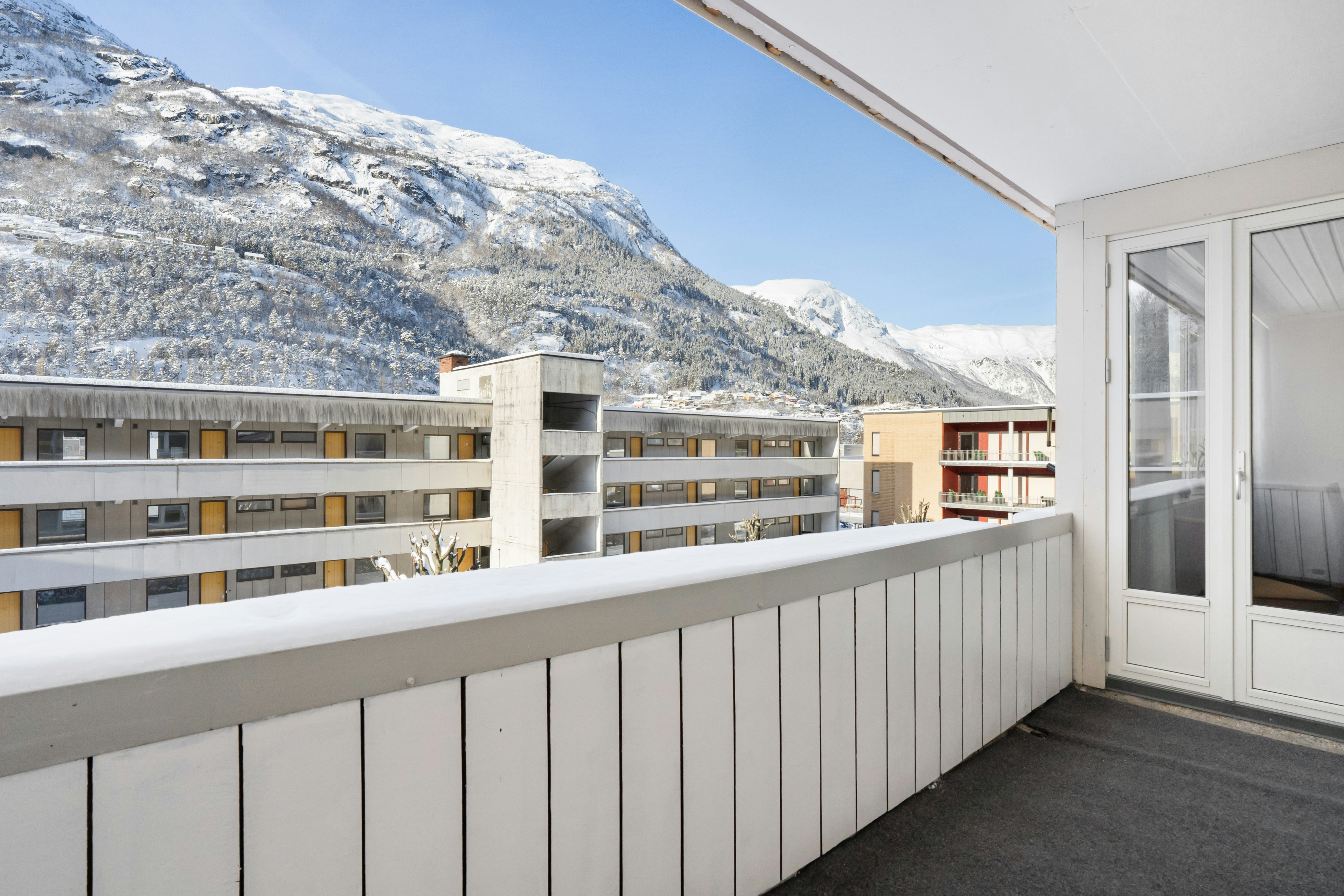 A balcony with a view of a mountain