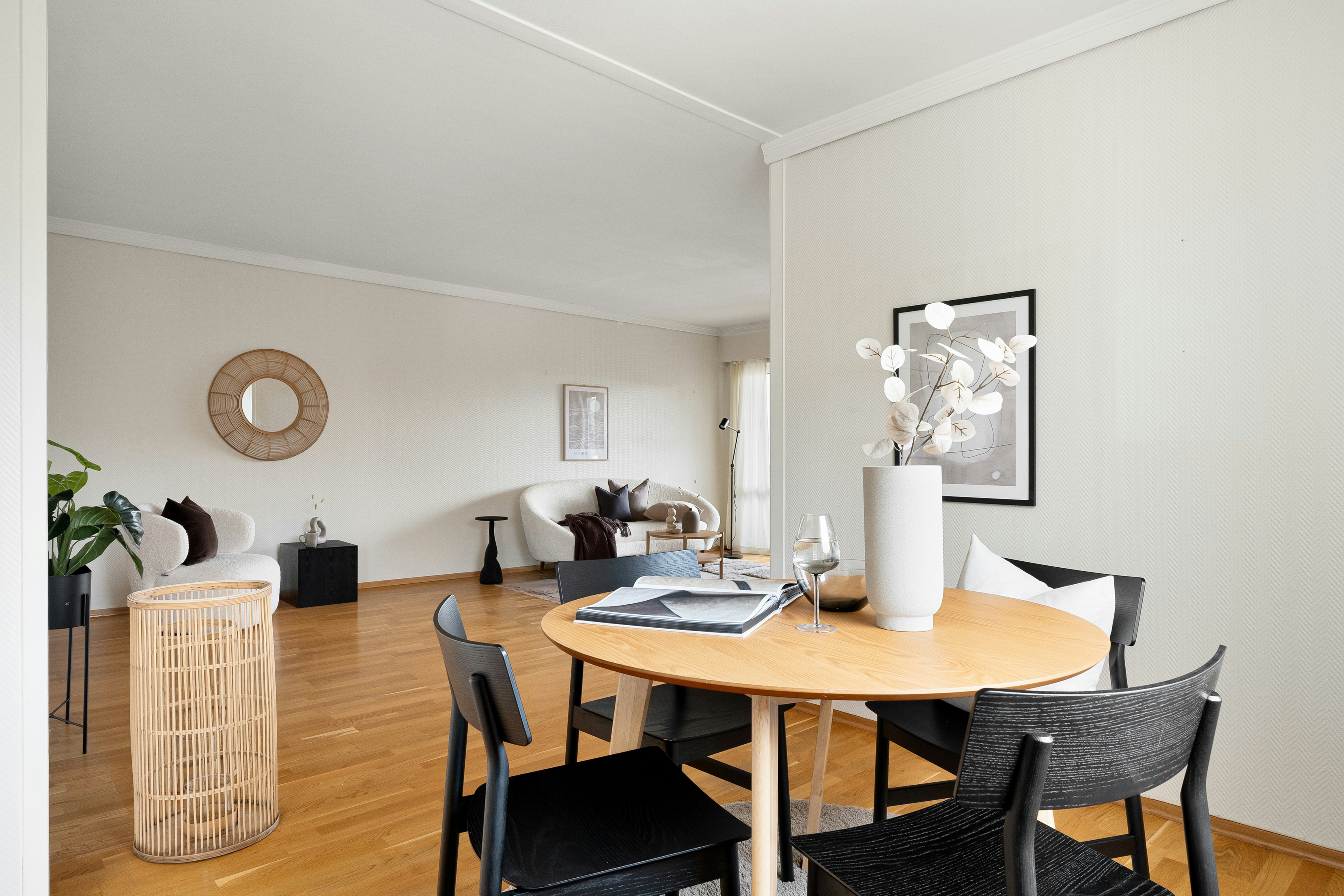 A dining room with a table and chairs