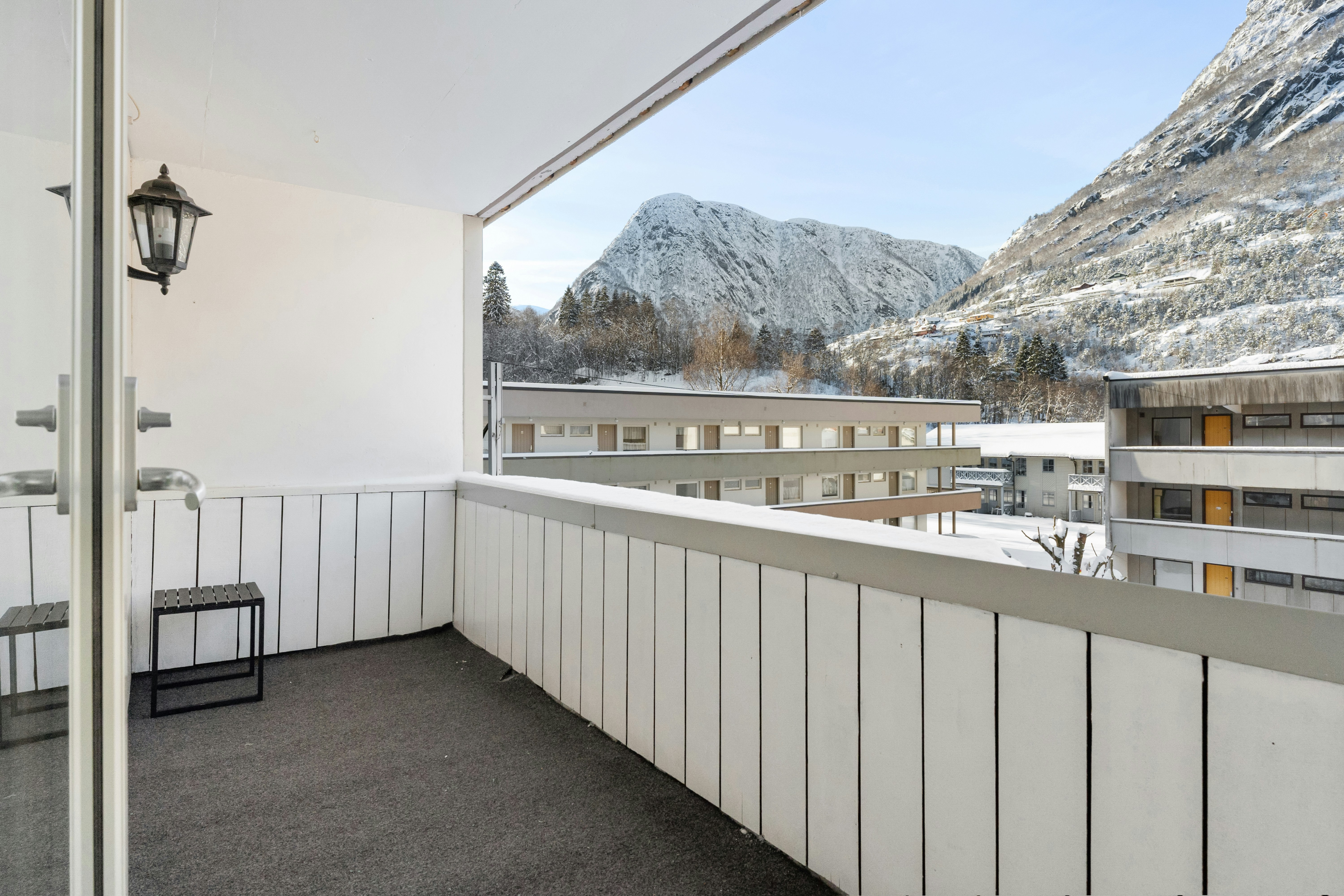 A balcony with a view of a mountain