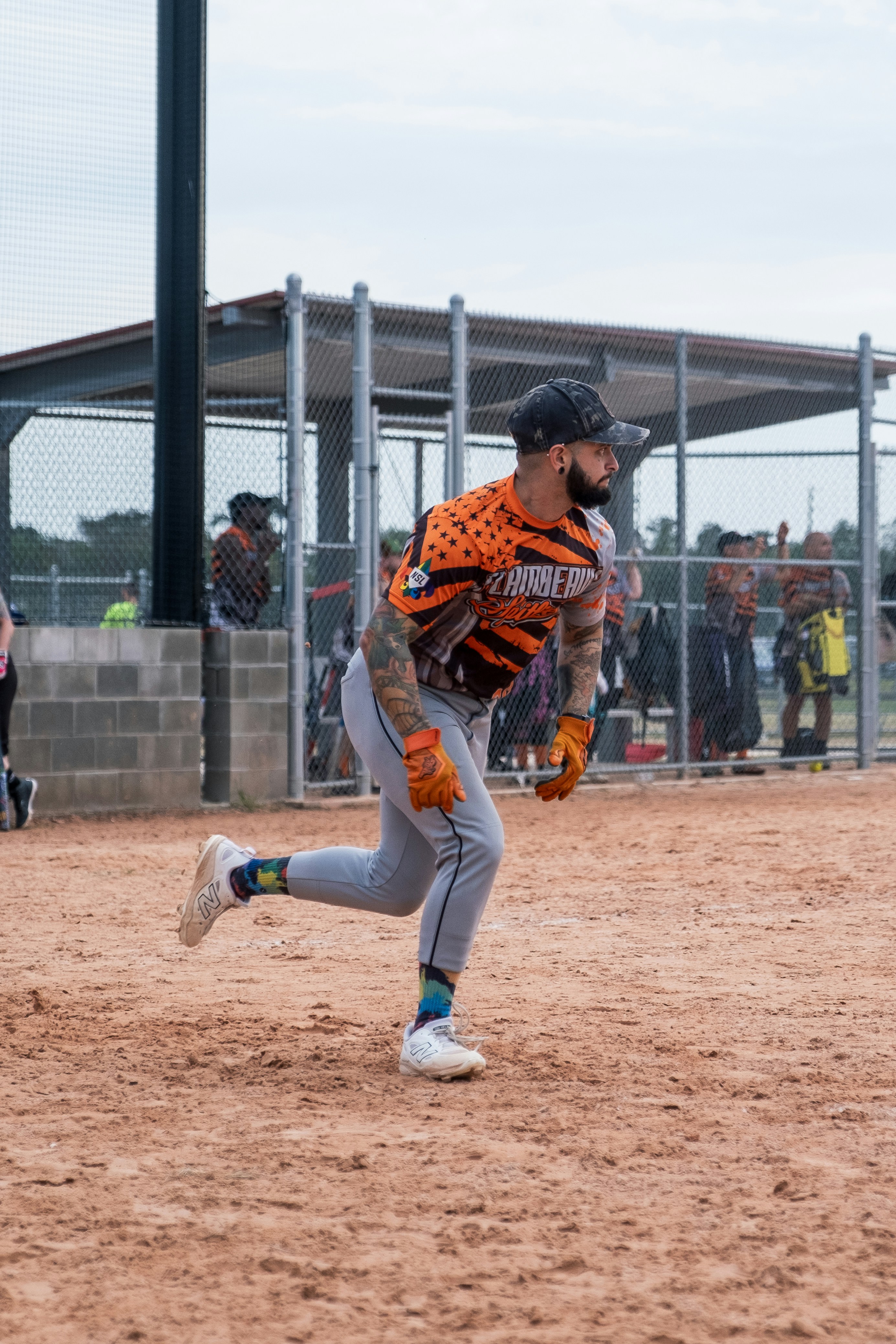A baseball player running to first base during a game photo – Free Blue ...
