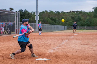 A baseball player swinging a bat at a ball