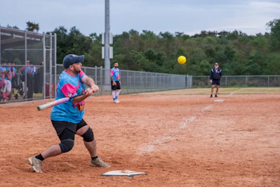 A baseball player swinging a bat at a ball