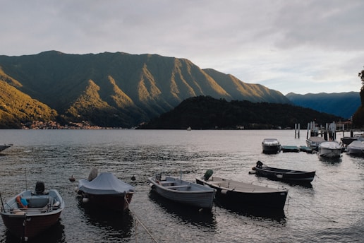 A group of boats floating on top of a lake