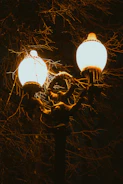 A couple of street lights sitting on top of a pole