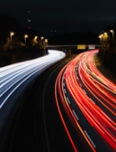 A long exposure photo of a highway at night
