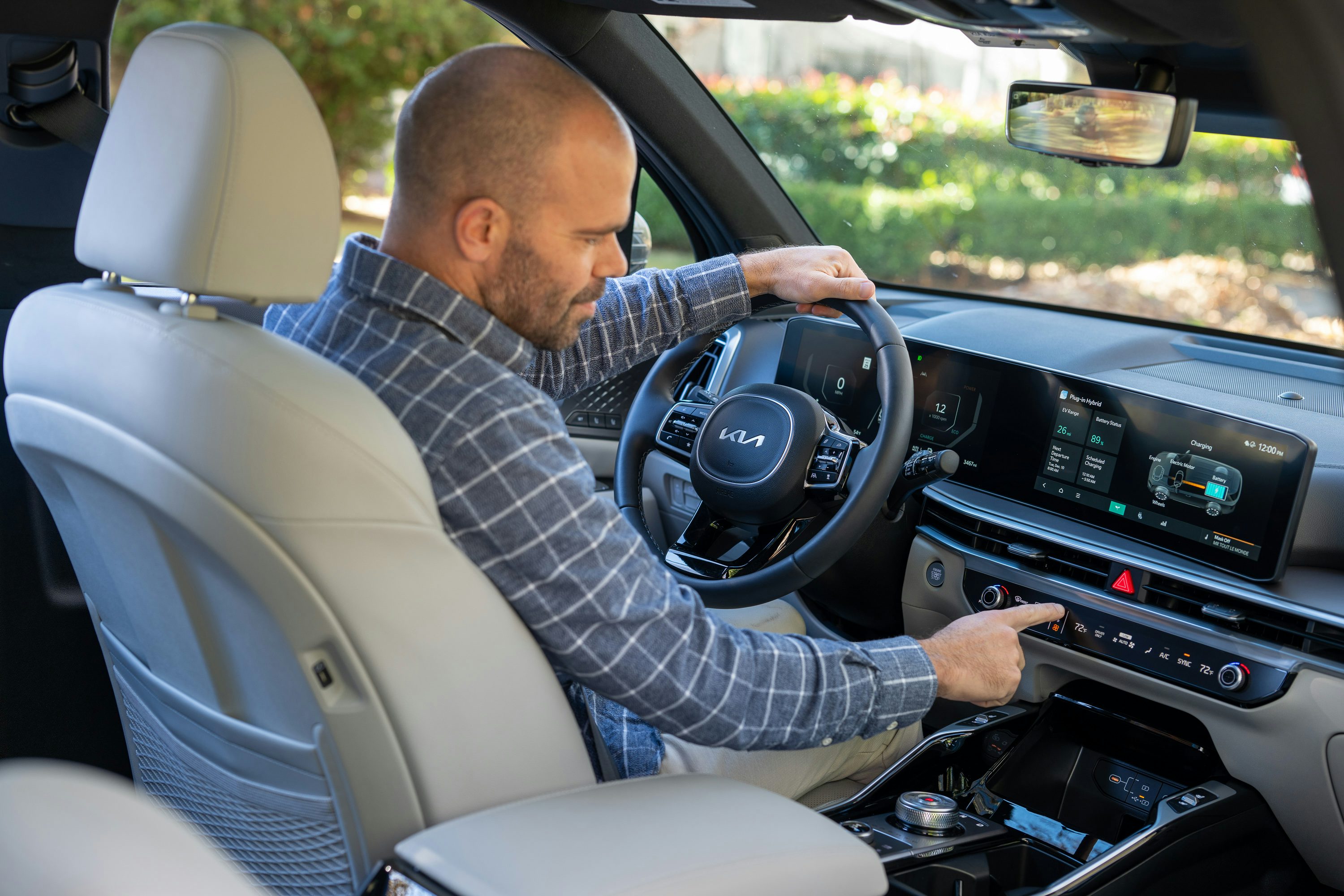 A man sitting in the driver's seat of a car