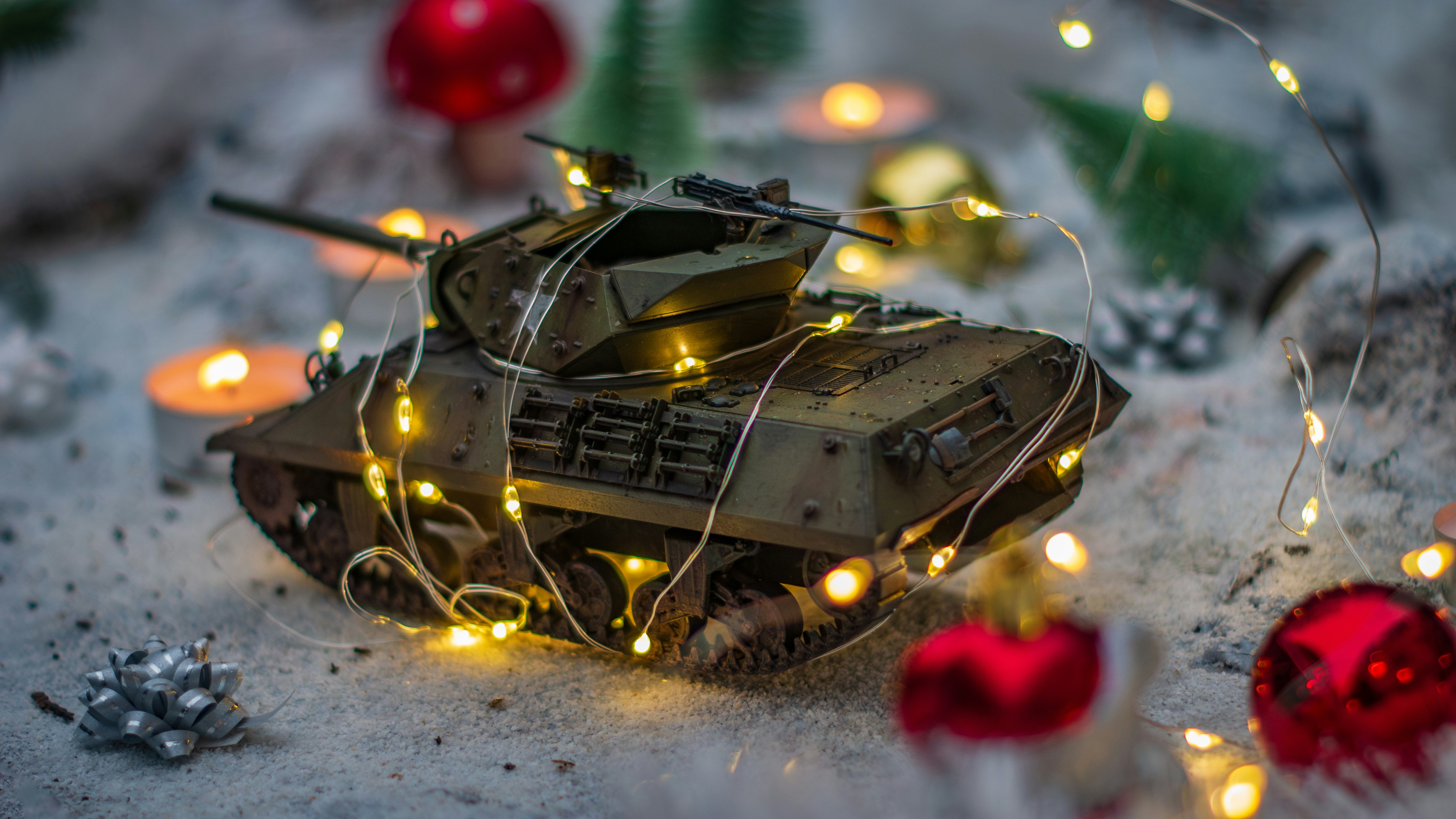 A toy tank with lights on top of it