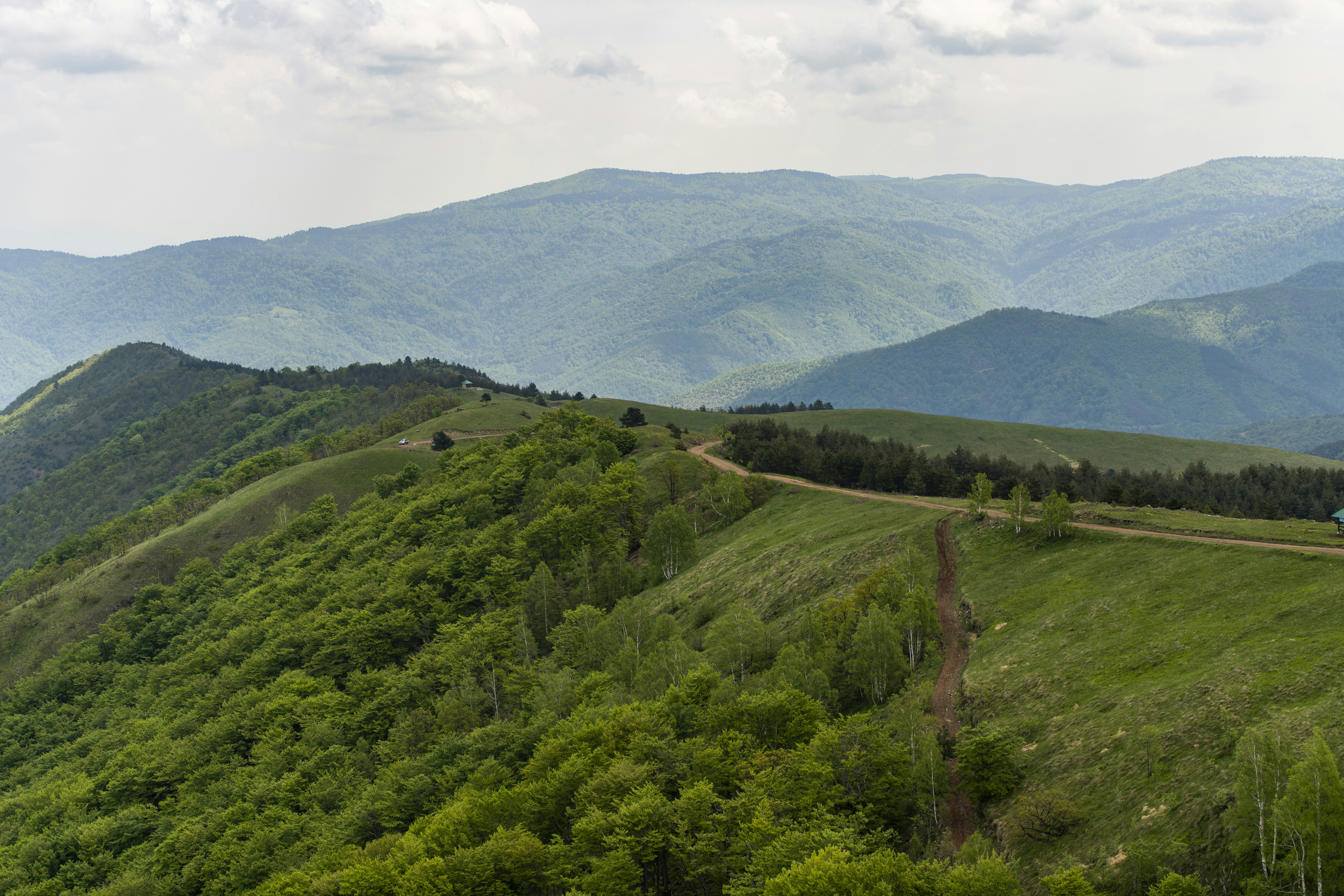 A scenic view of mountains and a road
