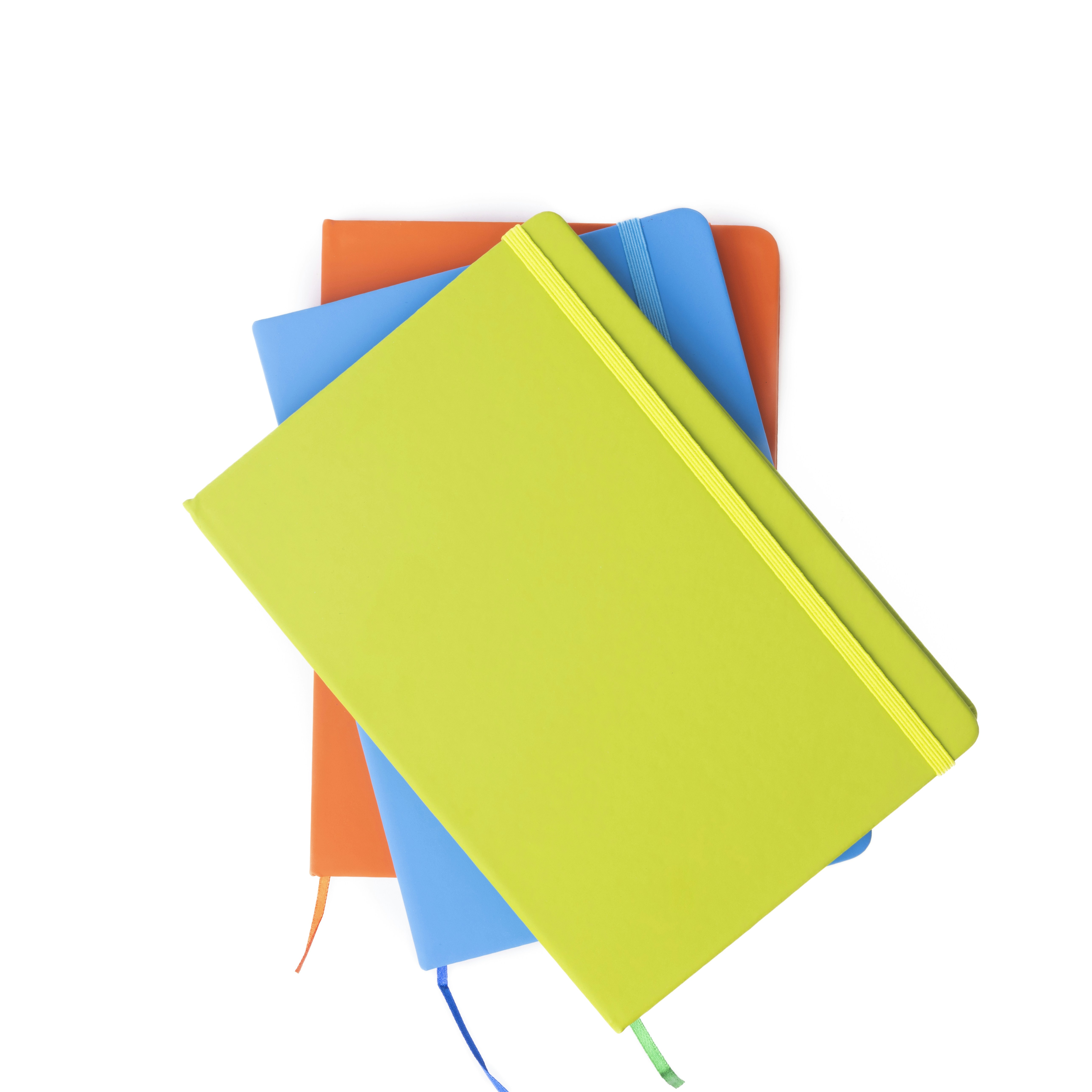 A stack of notebooks sitting on top of each other