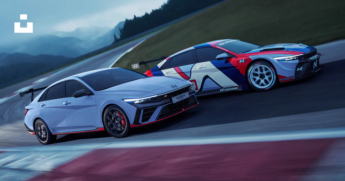 Two cars driving on a race track at night photo – Free Car Image on ...