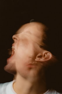 A man with his mouth open looking up