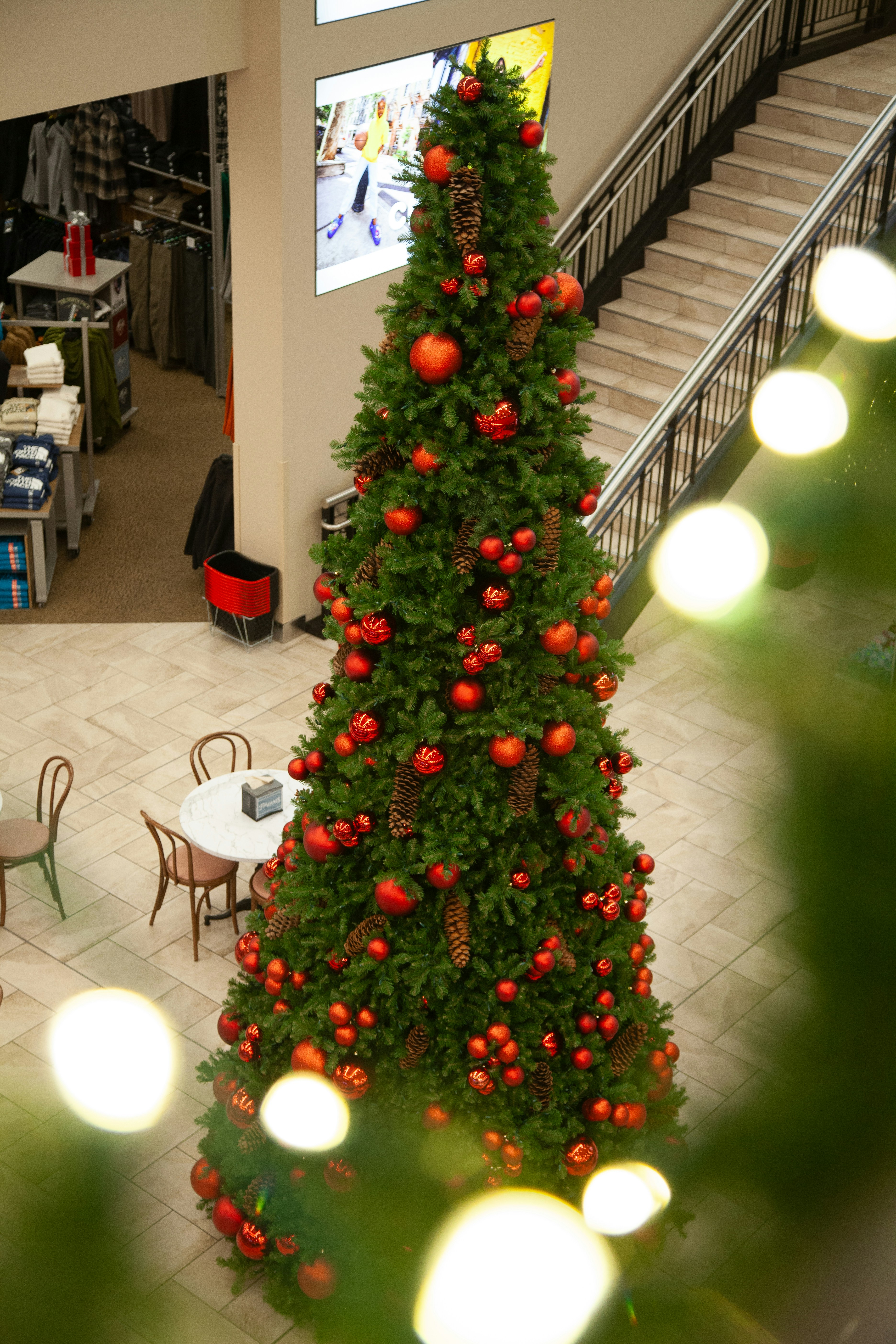 A christmas tree in the middle of a shopping mall