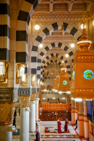 The interior of a large building with a clock on the wall