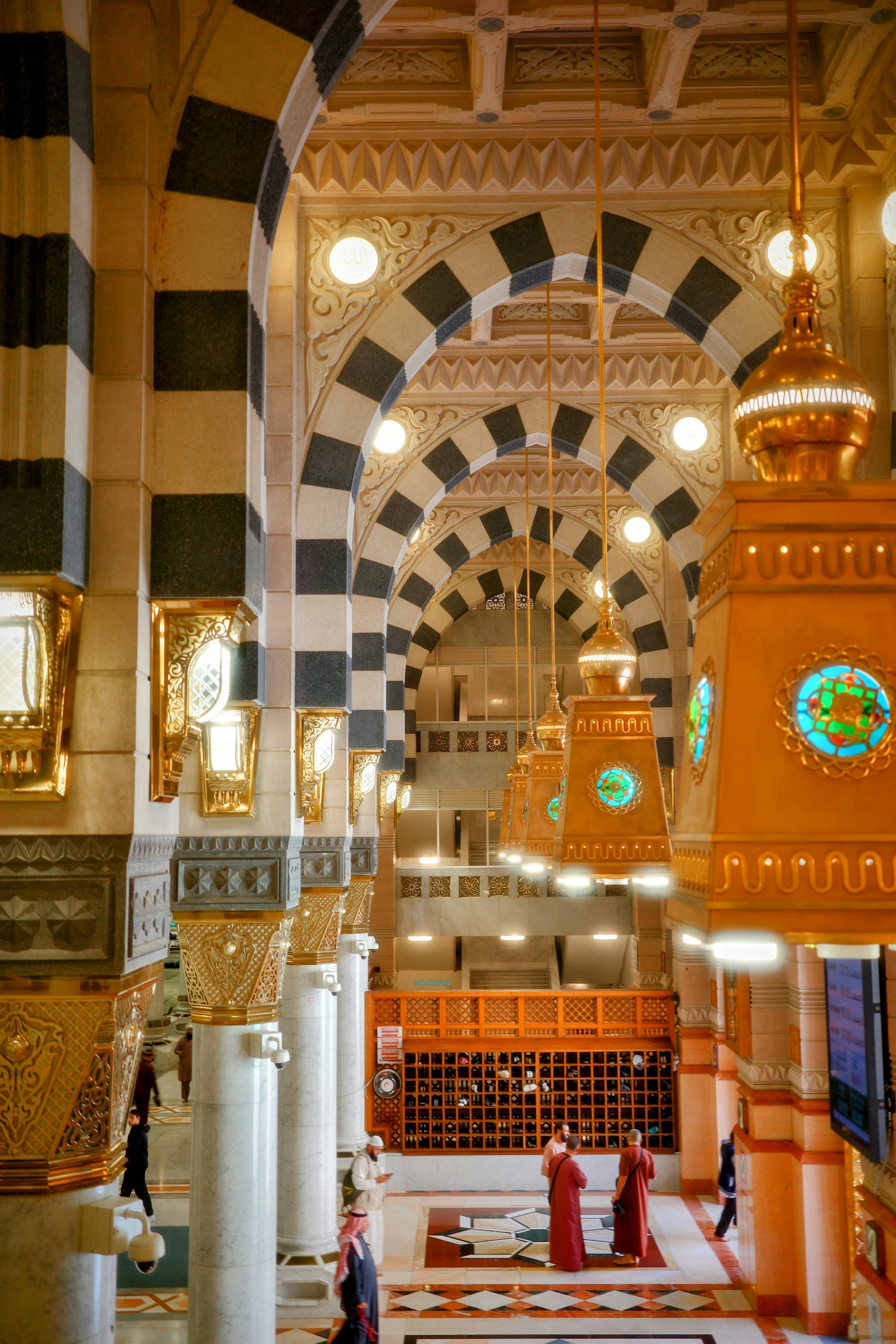 The interior of a large building with a clock on the wall
